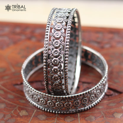 Sterling silver floral design bangle bracelet from TRIBAL ORNAMENTS, showcasing intricate ethnic jewelry craftsmanship.