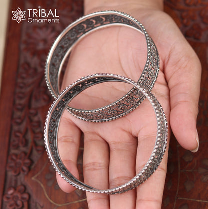 Sterling silver floral design bangle kada from TRIBAL ORNAMENTS, showcasing intricate ethnic jewelry craftsmanship.