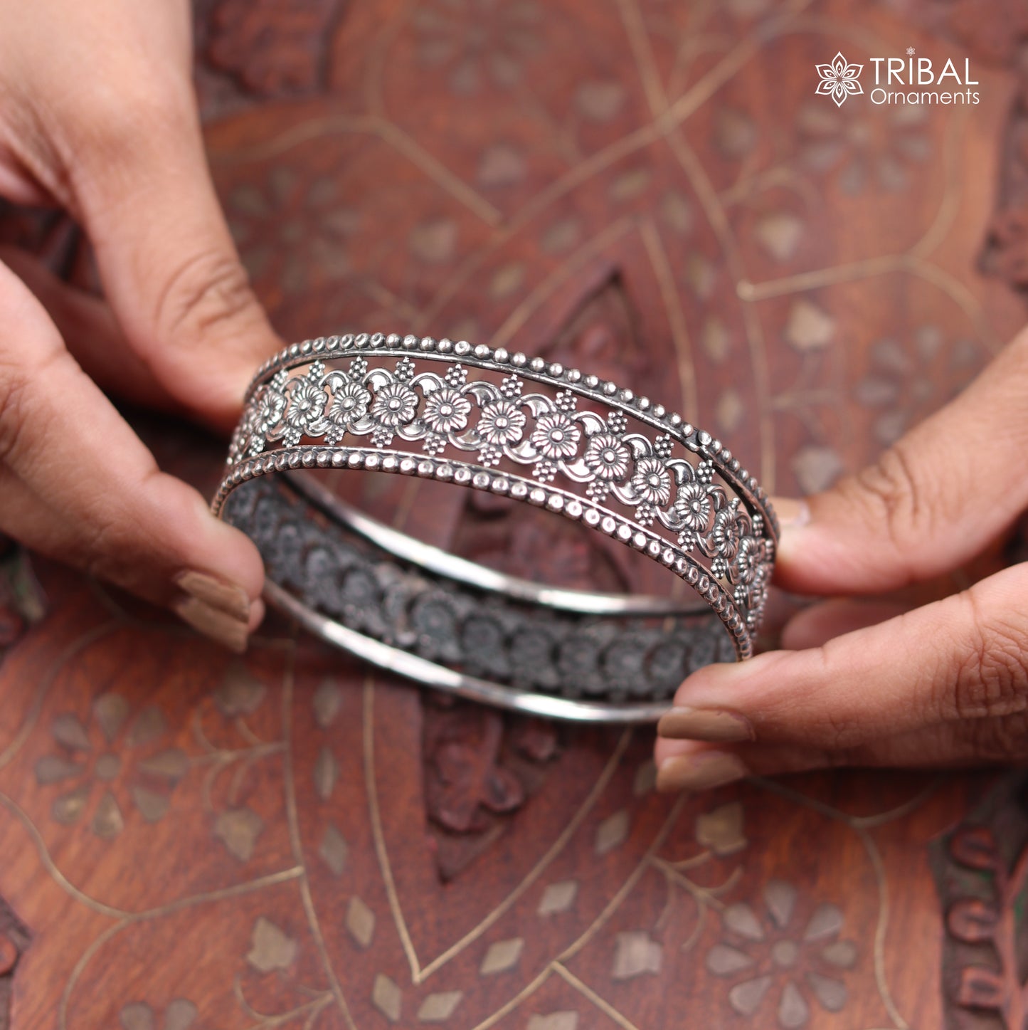 Sterling silver floral design bangle kada from TRIBAL ORNAMENTS, showcasing intricate ethnic jewelry craftsmanship.
