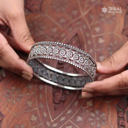Sterling silver floral design bangle kada from TRIBAL ORNAMENTS, showcasing intricate ethnic jewelry craftsmanship.