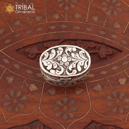 Vintage 925 sterling silver flower design oval Sindoor box for brides jewelry by TRIBAL ORNAMENTS, detailed floral pattern.