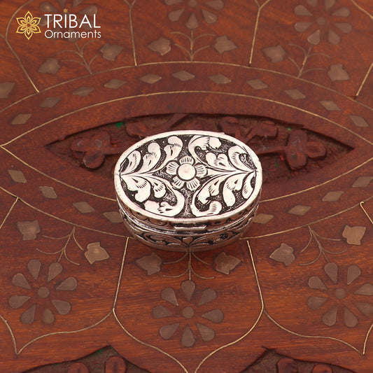 Vintage 925 sterling silver flower design oval Sindoor box for brides jewelry by TRIBAL ORNAMENTS, detailed floral pattern.