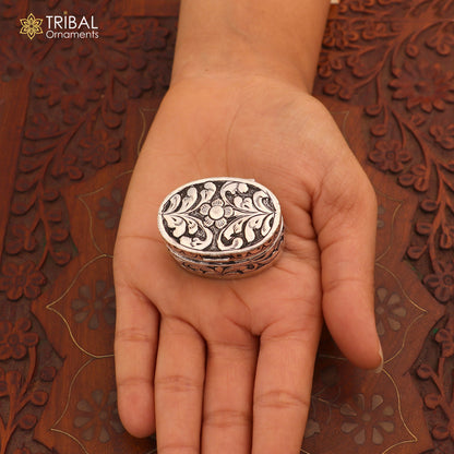 Vintage sterling silver flower-shaped oval trinket box by TRIBAL ORNAMENTS, featuring intricate floral design for jewelry storage.
