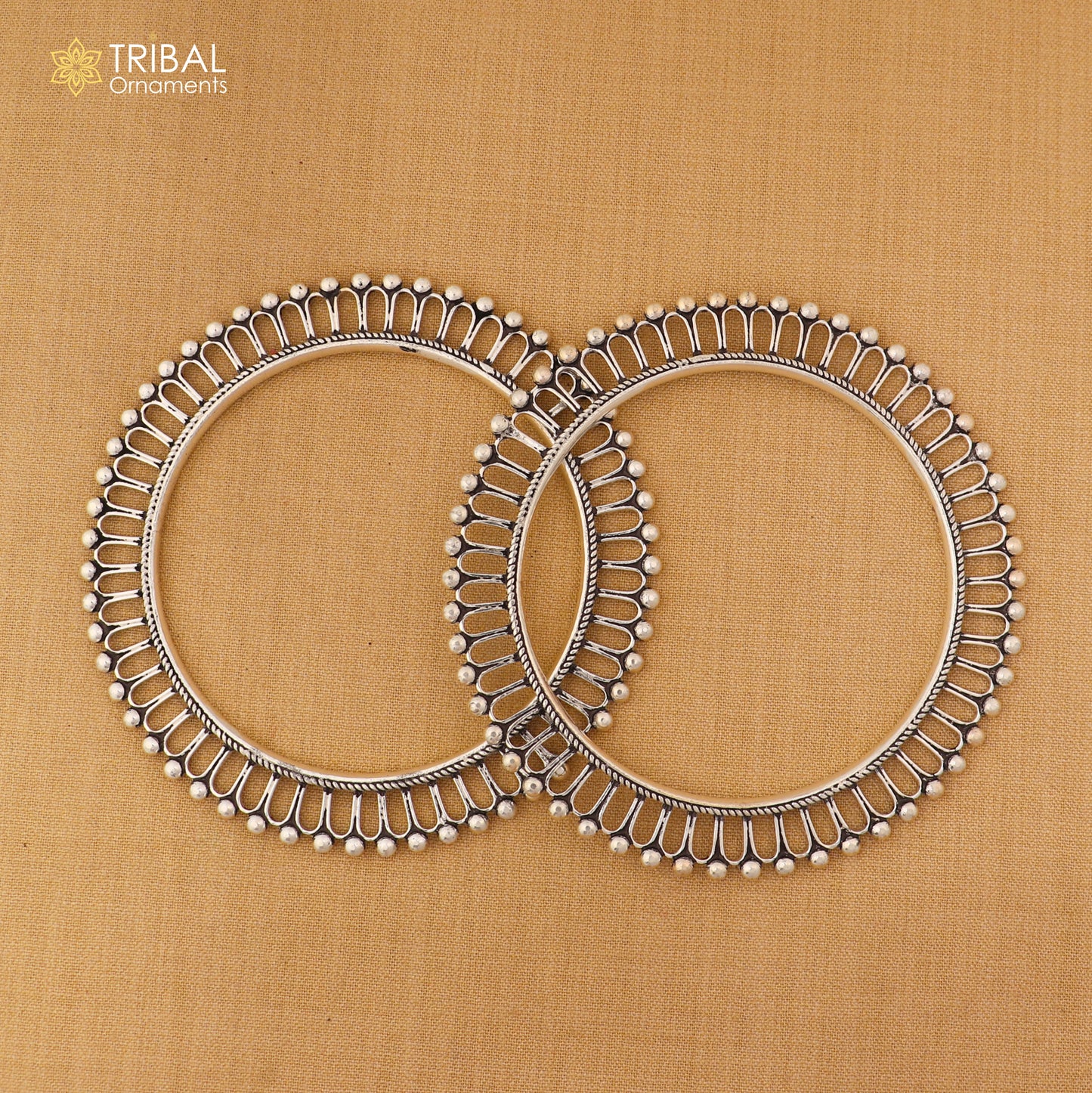 Sterling silver sun-inspired design bangle kada from TRIBAL ORNAMENTS, featuring ethnic jewelry style with intricate details.