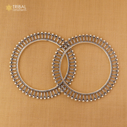 Sterling silver sun-inspired design bangle kada from TRIBAL ORNAMENTS, featuring ethnic jewelry style with intricate details.