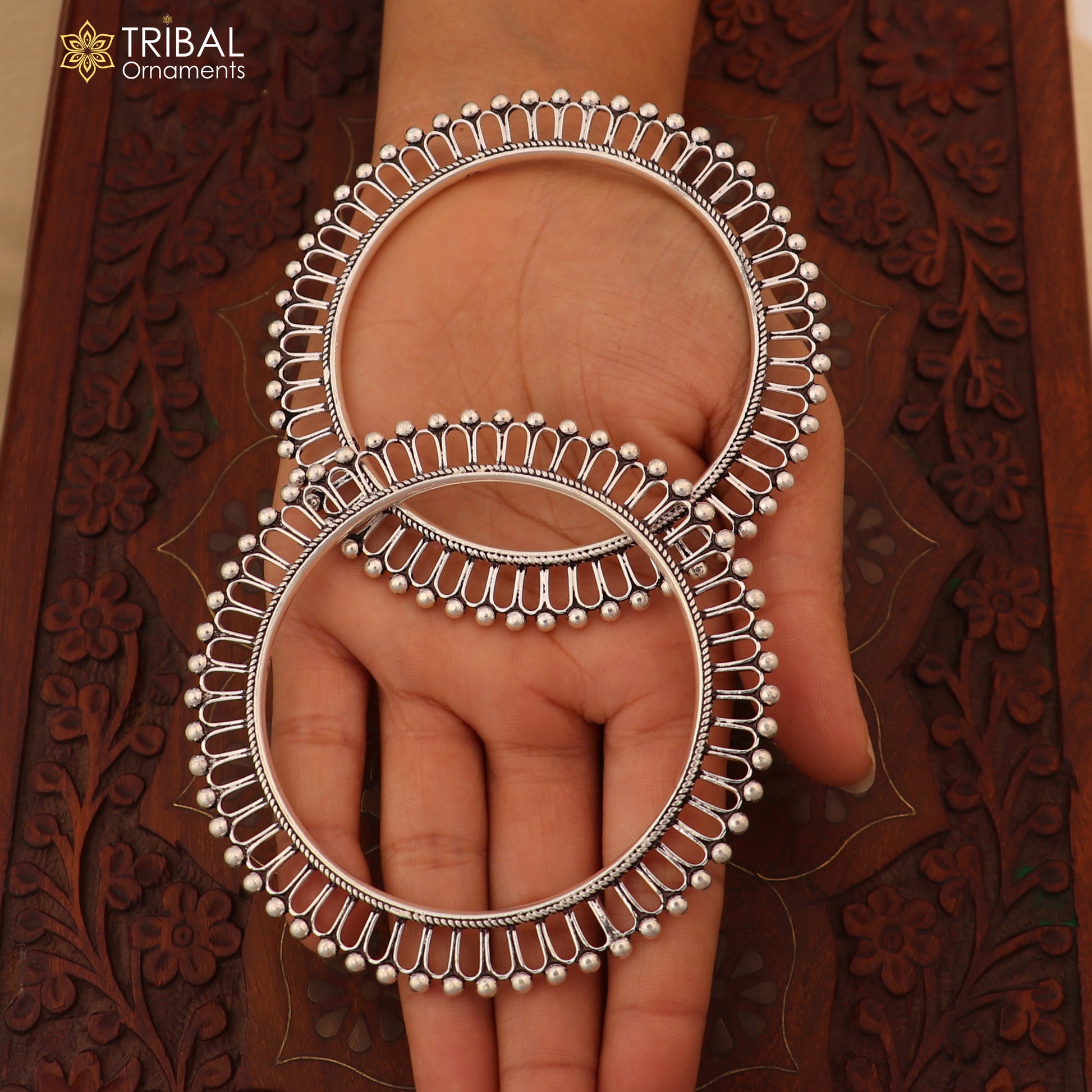 Sterling silver sun-inspired bangle Kada by TRIBAL ORNAMENTS, featuring ethnic jewelry design with intricate craftsmanship.