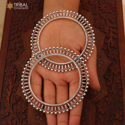 Sterling silver sun-inspired bangle Kada by TRIBAL ORNAMENTS, featuring ethnic jewelry design with intricate craftsmanship.