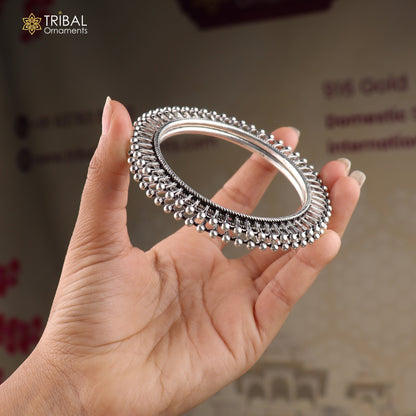 Sterling silver sun-inspired design bangle or kada from TRIBAL ORNAMENTS, showcasing intricate ethnic jewelry craftsmanship.