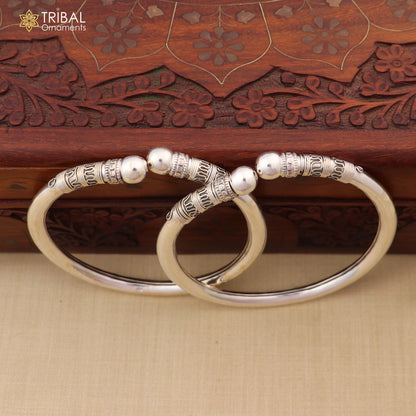 Sterling silver vintage ankle bracelet with customized design, intricate kada jewelry by TRIBAL ORNAMENTS, shown on foot.