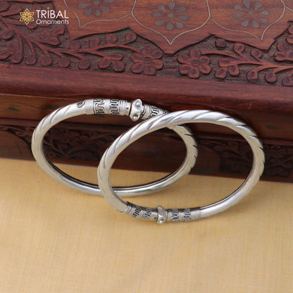 Sterling silver vintage ankle bracelet with intricate design, customized foot jewelry by TRIBAL ORNAMENTS, displayed on a white background.