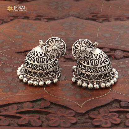 Sterling silver vintage floral jumka earring with oxidized finish, intricate design, handcrafted jewelry by TRIBAL ORNAMENTS.