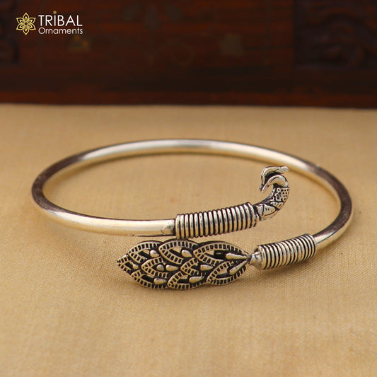 925 sterling silver Peacock style bangle bracelet with intricate design, featuring easy plug closure and traditional silver kada jewelry style.