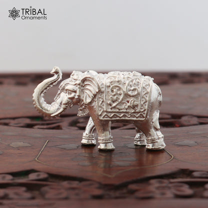 Sterling silver elephant sculpture by TRIBAL ORNAMENTS, a puja figurine symbolizing wealth and prosperity, detailed craftsmanship.