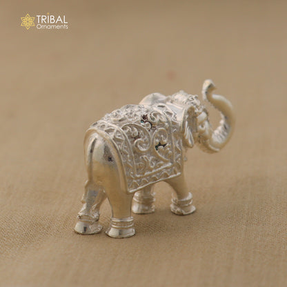 925 Sterling silver elephant sculpture figurine by TRIBAL ORNAMENTS, detailed puja art piece symbolizing wealth and prosperity.