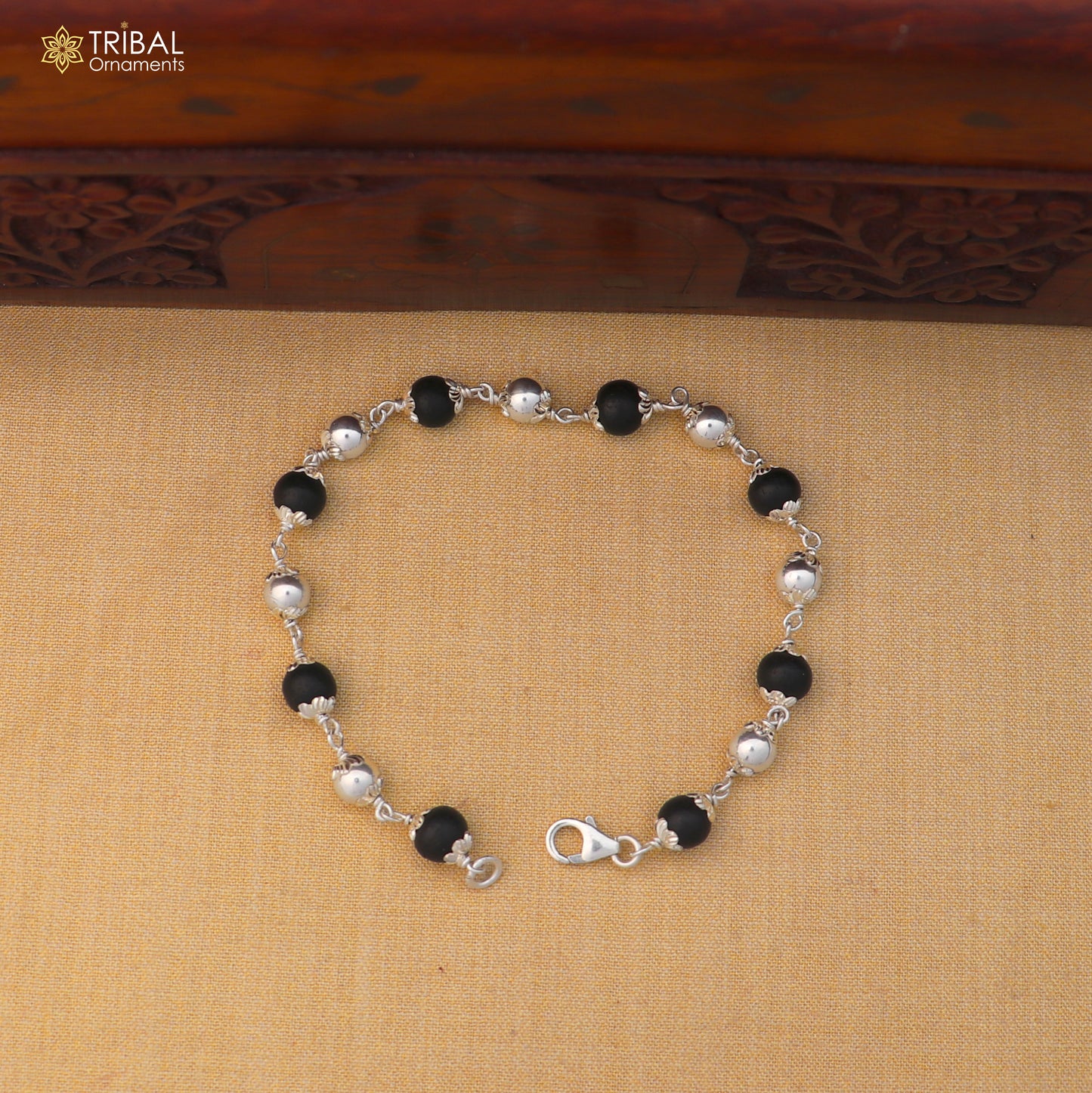 Unisex 925 sterling silver and black karungali beads bracelet with tribal design, crafted by TRIBAL ORNAMENTS.