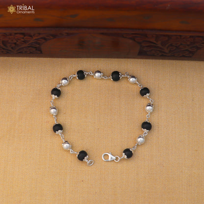 Unisex 925 sterling silver and black karungali beads bracelet with tribal design, crafted by TRIBAL ORNAMENTS.