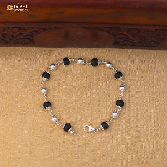 Unisex 925 sterling silver and black karungali beads bracelet with tribal design, crafted by TRIBAL ORNAMENTS.