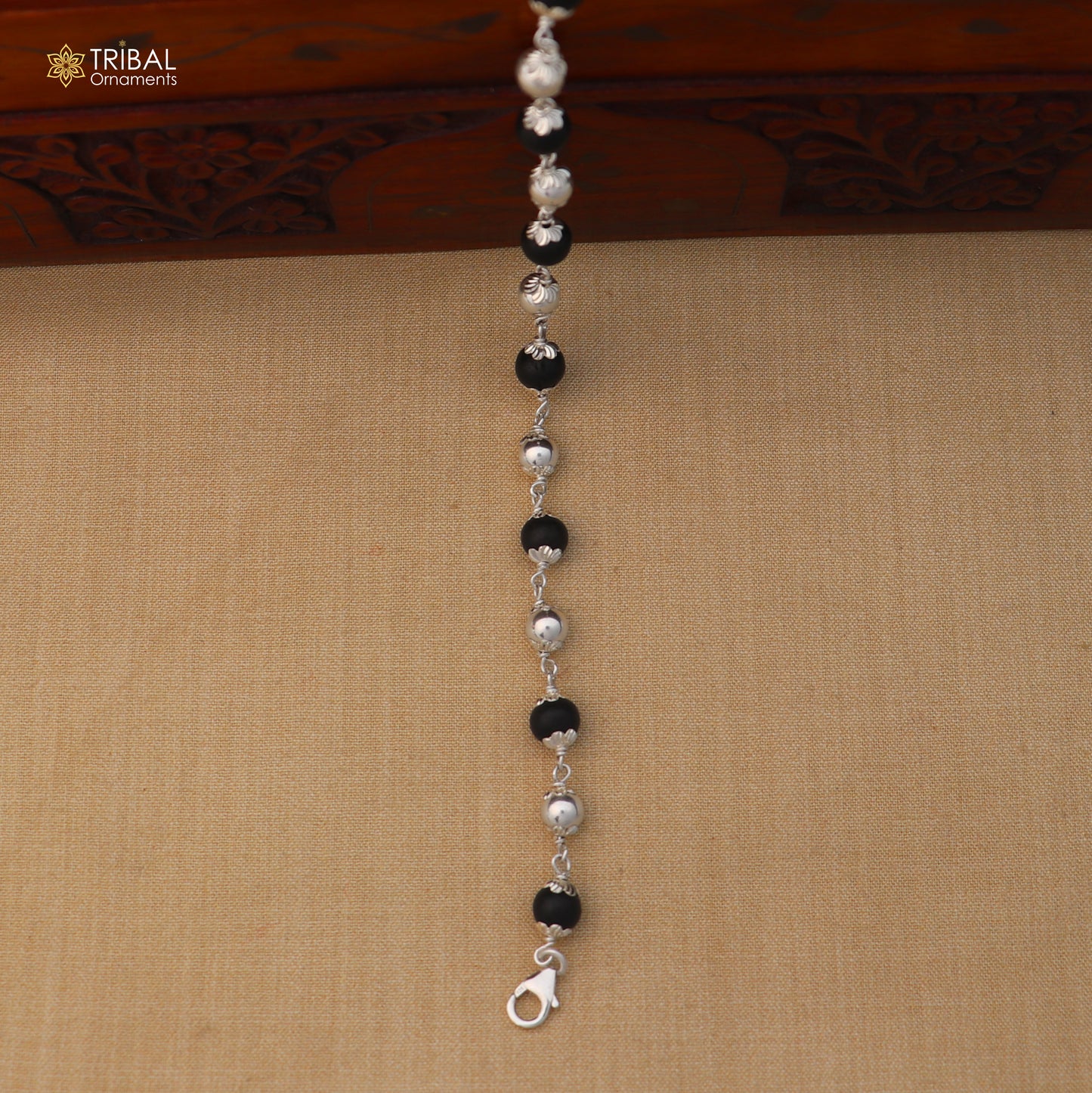Unisex 925 sterling silver and Karungali black beads bracelet from TRIBAL ORNAMENTS, featuring a stylish and handcrafted jewelry design.