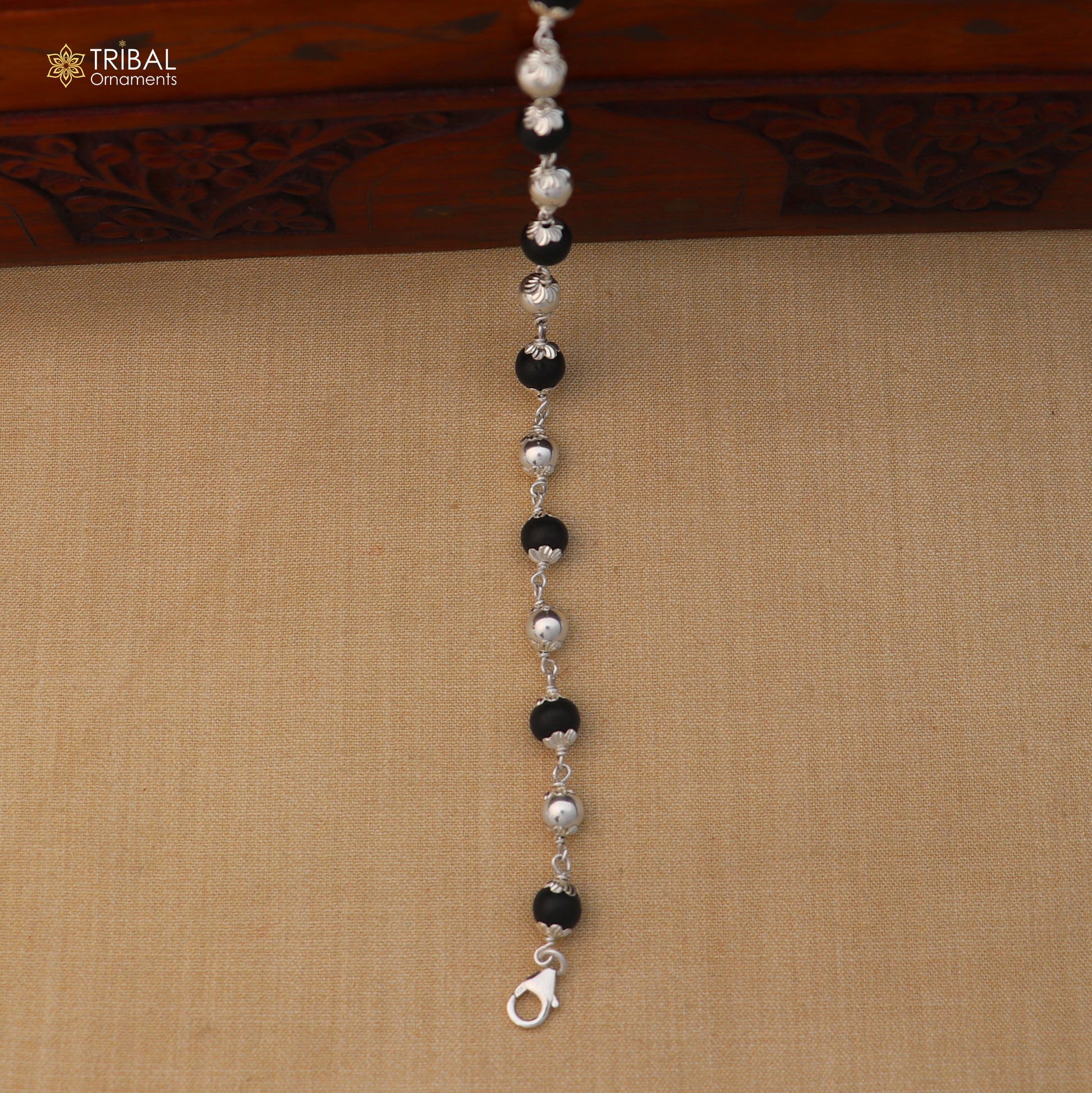 Unisex 925 sterling silver and Karungali black beads bracelet from TRIBAL ORNAMENTS, featuring a stylish and handcrafted jewelry design.