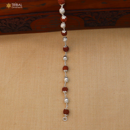 Unisex 925 sterling silver and rudraksha beads bracelet from TRIBAL ORNAMENTS, showing detailed silver and bead design.