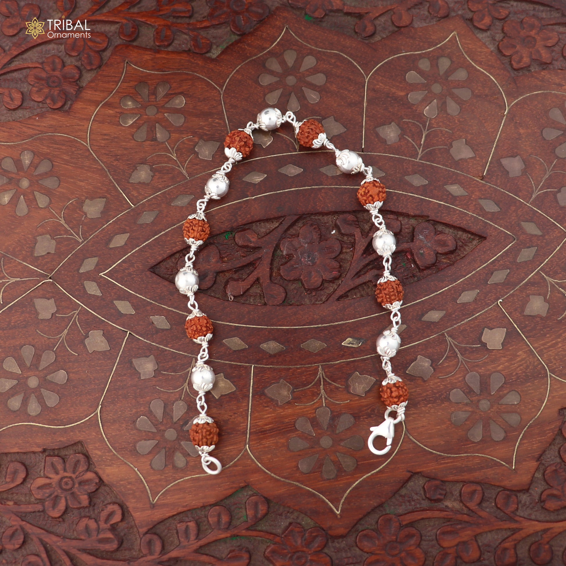 Unisex 925 sterling silver bracelet with Rudraksha beads by TRIBAL ORNAMENTS, featuring a detailed bead and silver design.