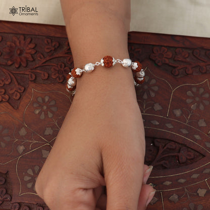Unisex 925 sterling silver bracelet with rudraksha beads, tribal ornament style, intricate design for unique jewelry look.