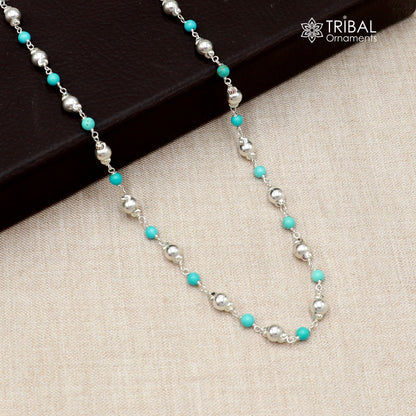 Sterling silver beaded necklace with turquoise-colored round stones, handcrafted by TRIBAL ORNAMENTS.