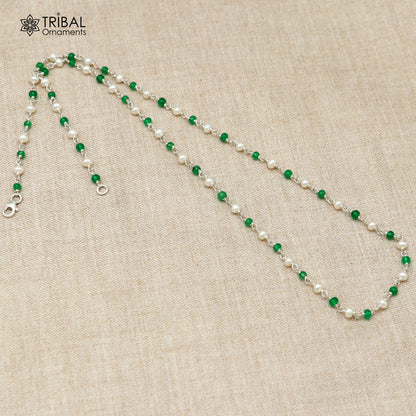 Sterling silver beaded chain with pearl and green stone accents, crafted by TRIBAL ORNAMENTS, shown against a neutral background.