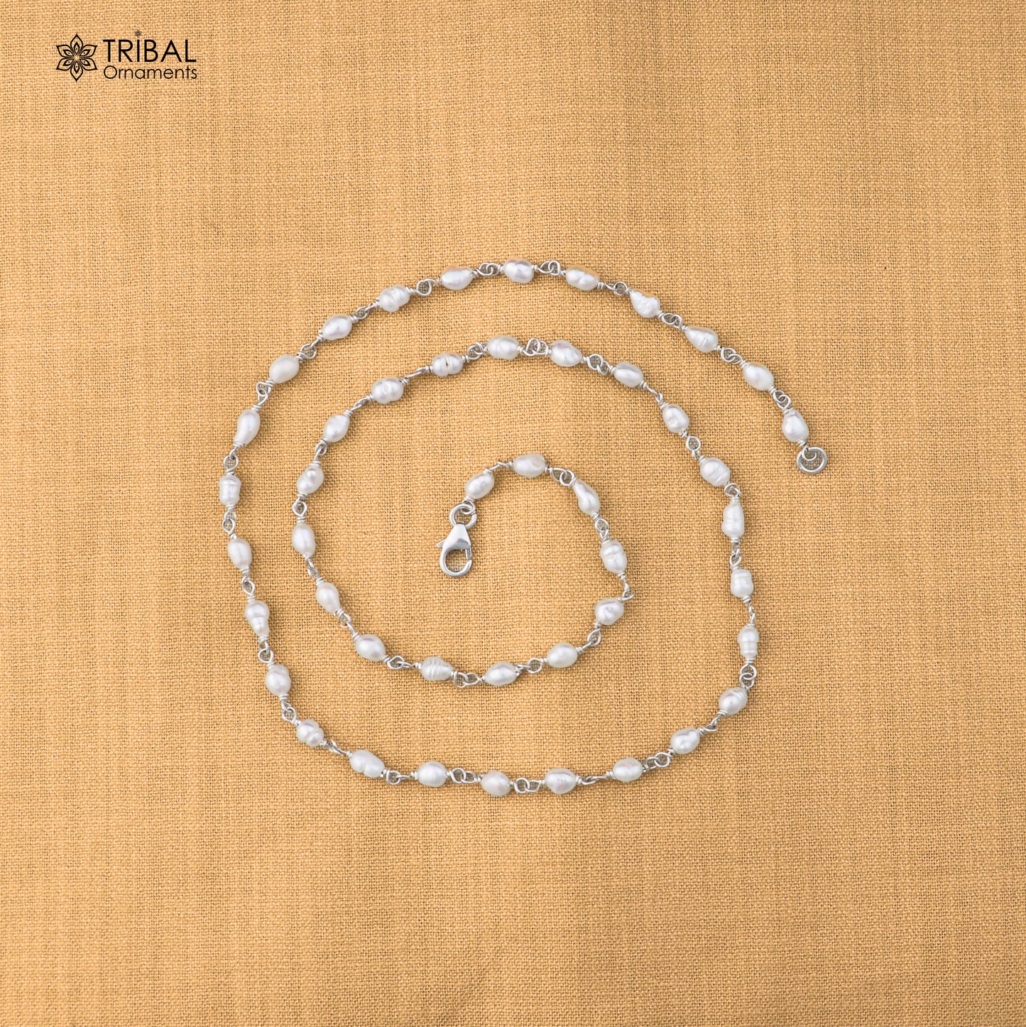 Sterling silver pearl beads necklace by TRIBAL ORNAMENTS, featuring elegant white pearls on a delicate silver chain.