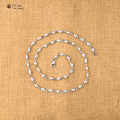 Sterling silver pearl beads necklace by TRIBAL ORNAMENTS, featuring elegant white pearls on a delicate silver chain.