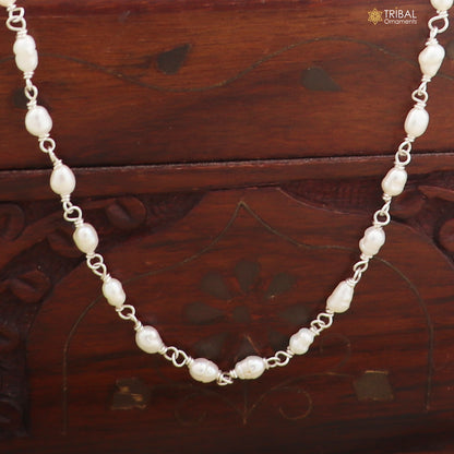 Sterling silver pearl beads necklace by TRIBAL ORNAMENTS featuring a delicate string of lustrous pearls on a silver chain.