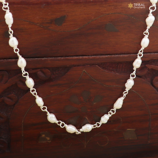 Sterling silver pearl beads necklace by TRIBAL ORNAMENTS featuring a delicate string of lustrous pearls on a silver chain.