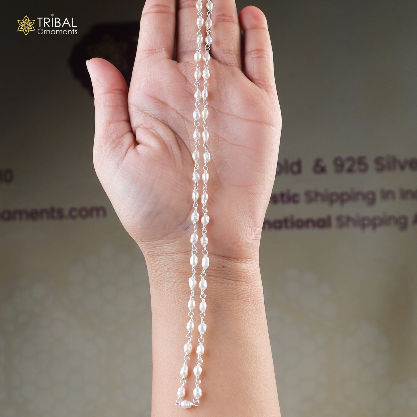 Sterling silver necklace with white pearl beads, featuring a simple and elegant design by TRIBAL ORNAMENTS.