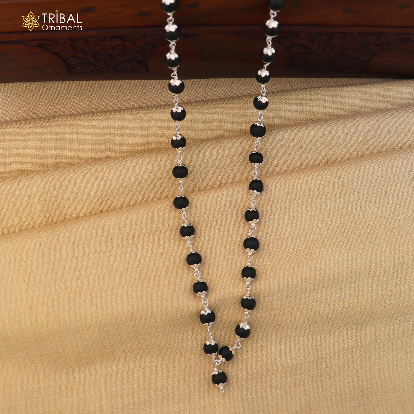 Handmade 54/108 beads Karungali round mala with 925 silver chain necklace by TRIBAL ORNAMENTS, featuring intricate beadwork and silver accents.