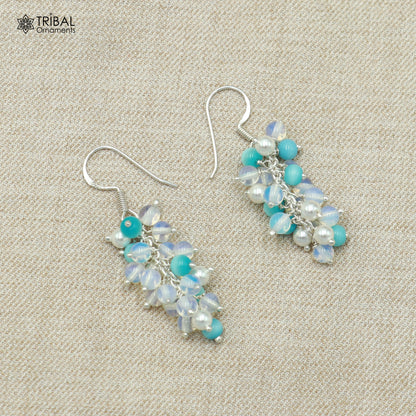 Sterling silver beaded drop dangle earring by TRIBAL ORNAMENTS, featuring intricate beaded design and elegant jewelry craftsmanship.