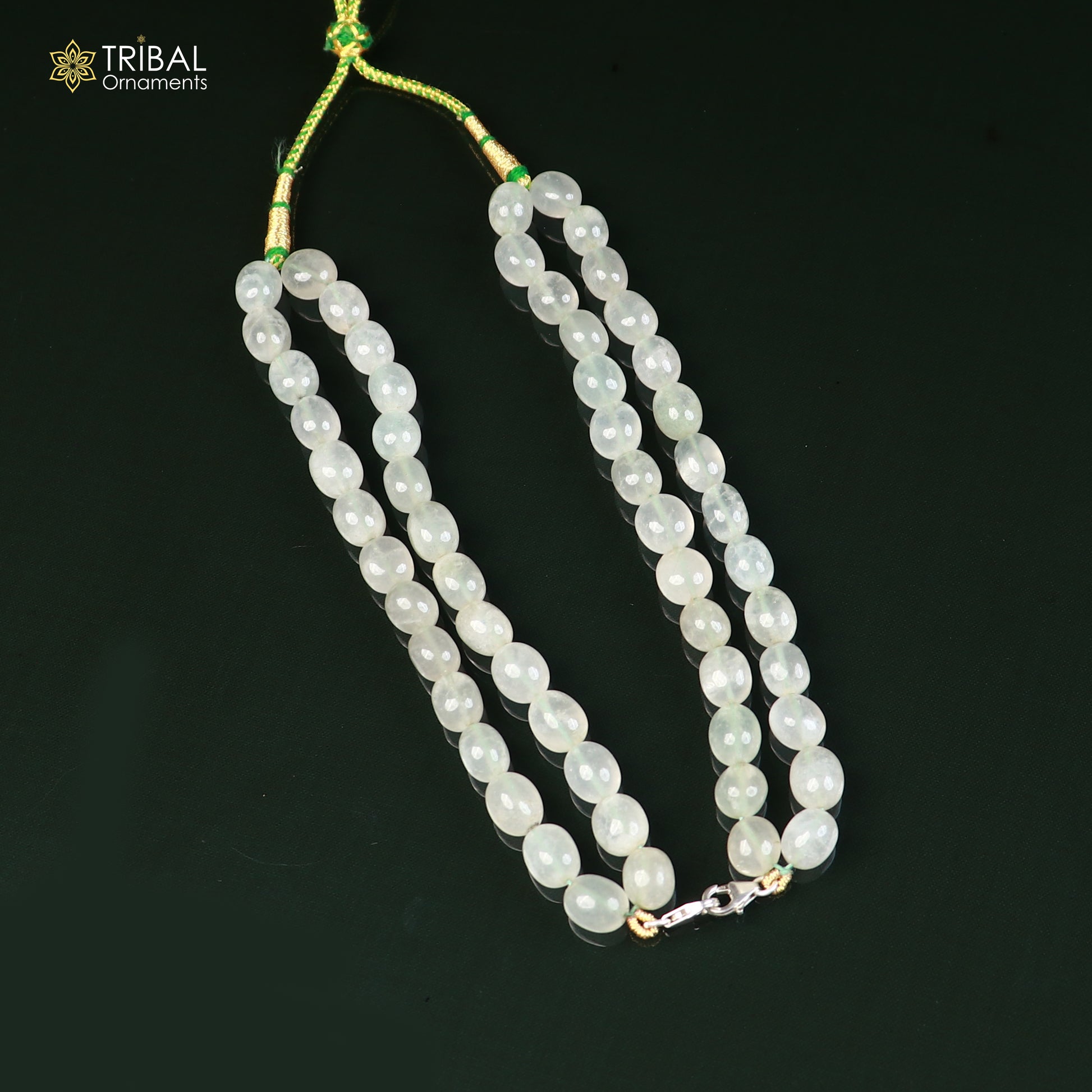 Sterling silver lock and jade stone beaded necklace with tribal jewelry style, featuring pendant and intricate bead details.