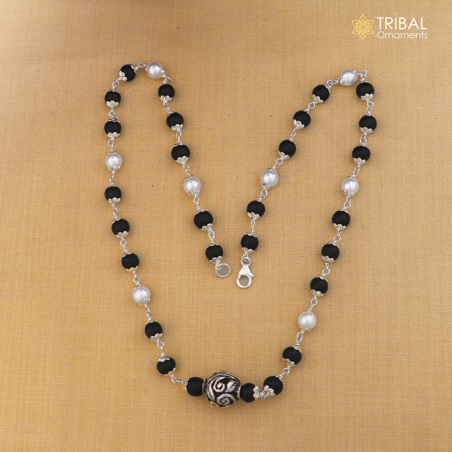 Sterling silver vintage necklace with pearl and karungali beads, featuring intricate tribal design by TRIBAL ORNAMENTS.