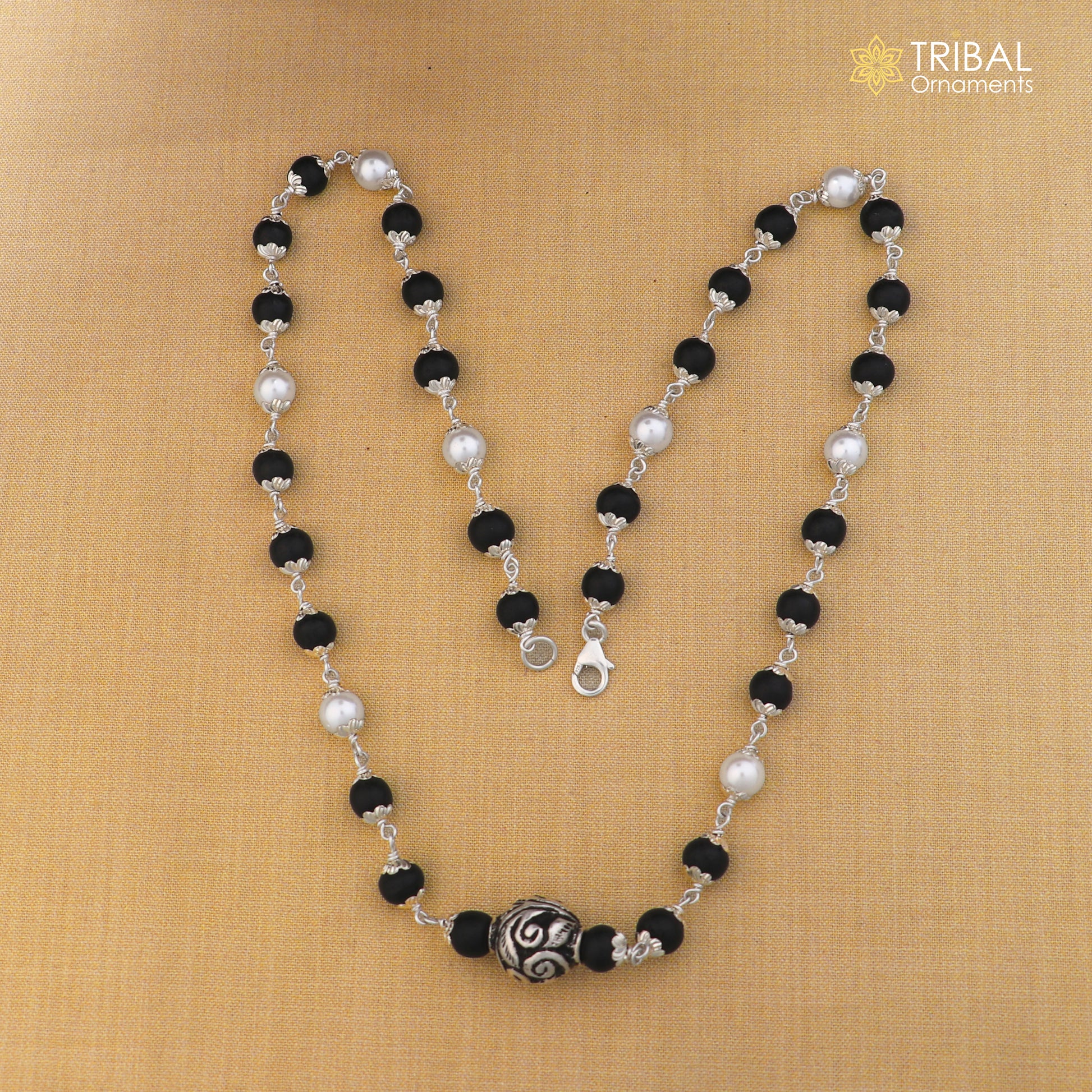Sterling silver vintage necklace with pearl and karungali beads, featuring intricate tribal design by TRIBAL ORNAMENTS.