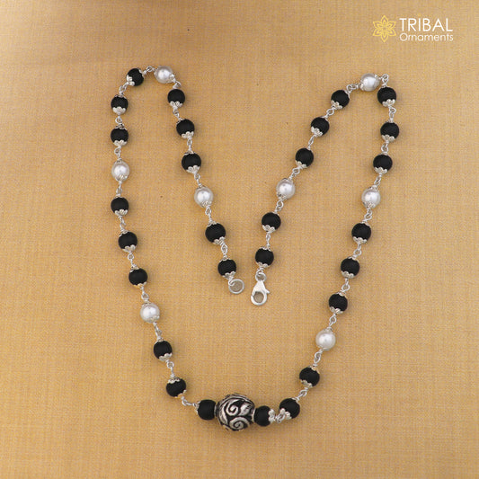Sterling silver vintage necklace with pearl and karungali beads, featuring intricate tribal design by TRIBAL ORNAMENTS.