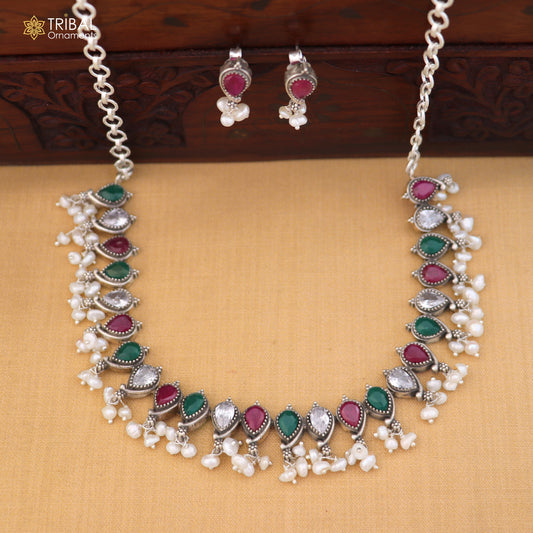 Sterling silver ethnic jewelry set with ruby red and green cut stones, includes necklace and earrings from TRIBAL ORNAMENTS.