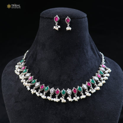 Sterling silver ethnic jewelry set with ruby red and green cut stones, includes necklace and earrings by TRIBAL ORNAMENTS.