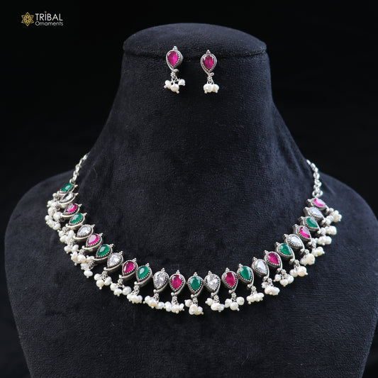 Sterling silver ethnic jewelry set with ruby red and green cut stones, includes necklace and earrings by TRIBAL ORNAMENTS.