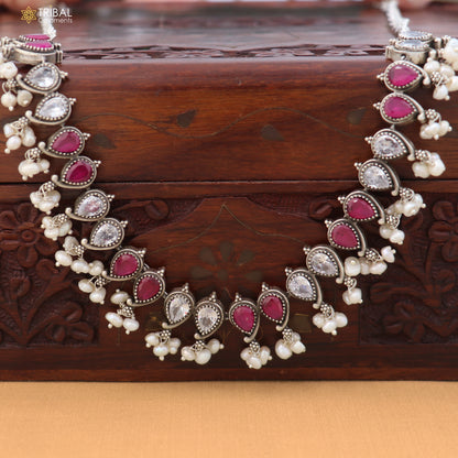 Sterling silver tribal jewelry set with ruby red and white cut stones, includes necklace and earrings with oxidized finish.