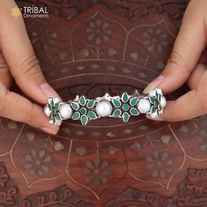 Sterling silver floral style stone bangle from TRIBAL ORNAMENTS, showcasing intricate ethnic jewelry design and gemstone details.