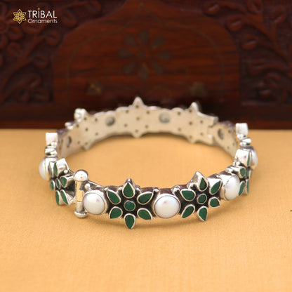 Sterling silver floral stone bangle bracelet with intricate ethnic design by TRIBAL ORNAMENTS, showcasing detailed craftsmanship.