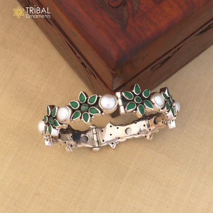 Sterling silver floral-style stone bangle bracelet with ethnic design from TRIBAL ORNAMENTS, featuring intricate detailing and gemstone accents.