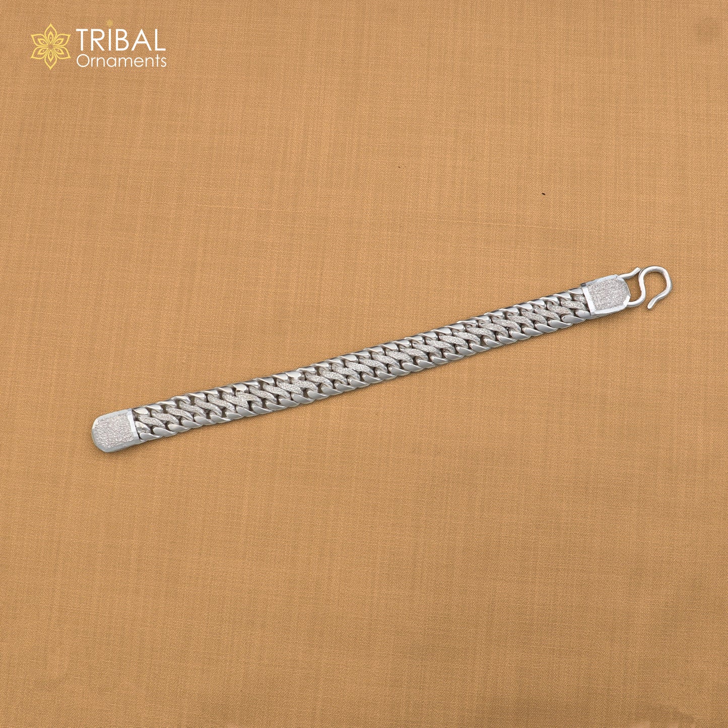 Sterling silver men's bracelet with customized design from TRIBAL ORNAMENTS, featuring personalized royal jewelry style.