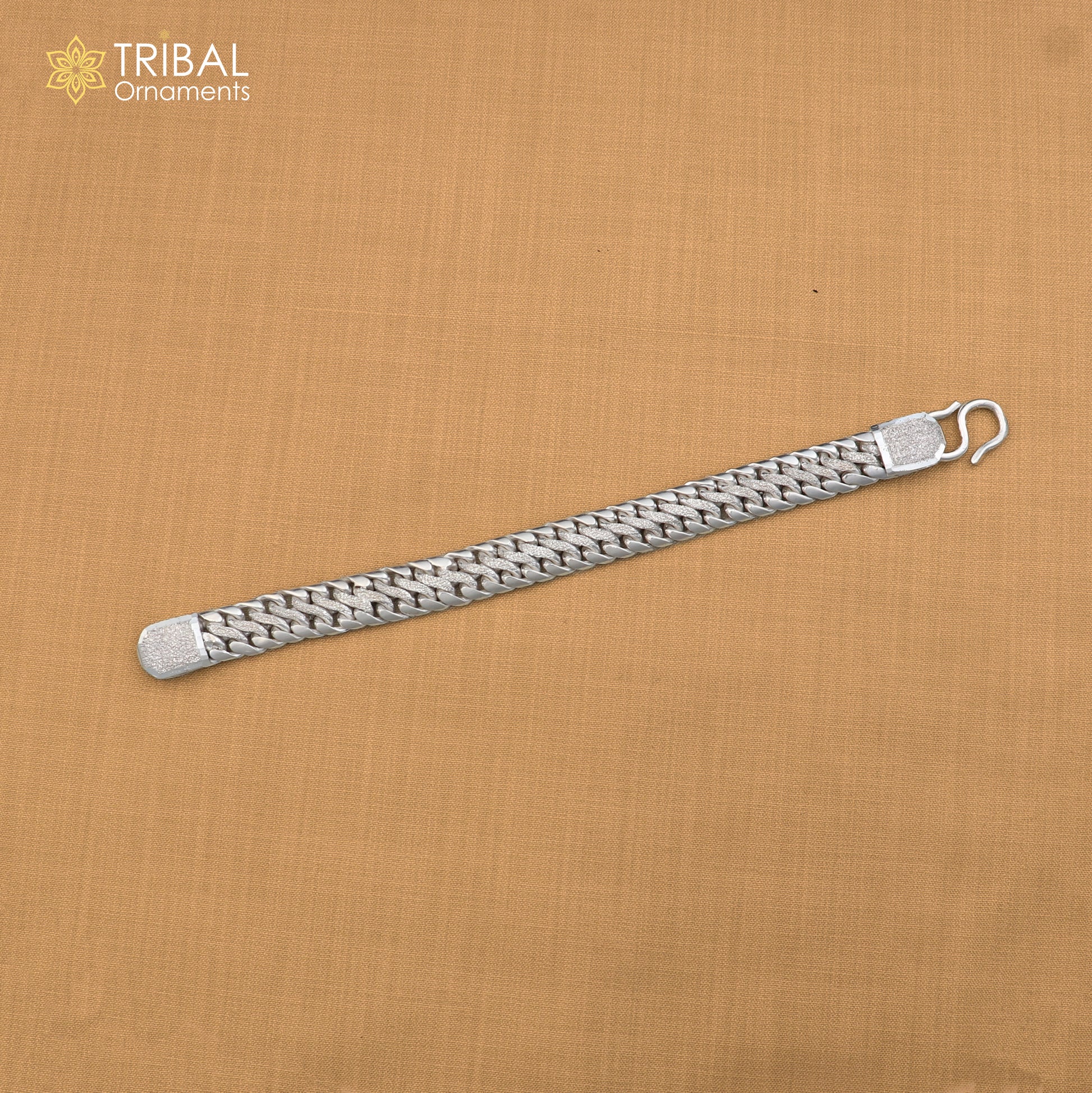 Sterling silver men's bracelet with customized design from TRIBAL ORNAMENTS, featuring personalized royal jewelry style.