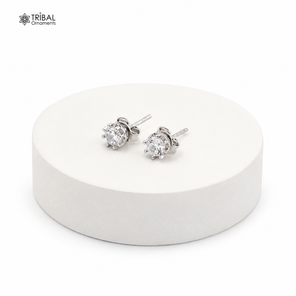 Sterling silver round white diamond stud earring by TRIBAL ORNAMENTS, unisex jewelry with sparkling gemstone detail.
