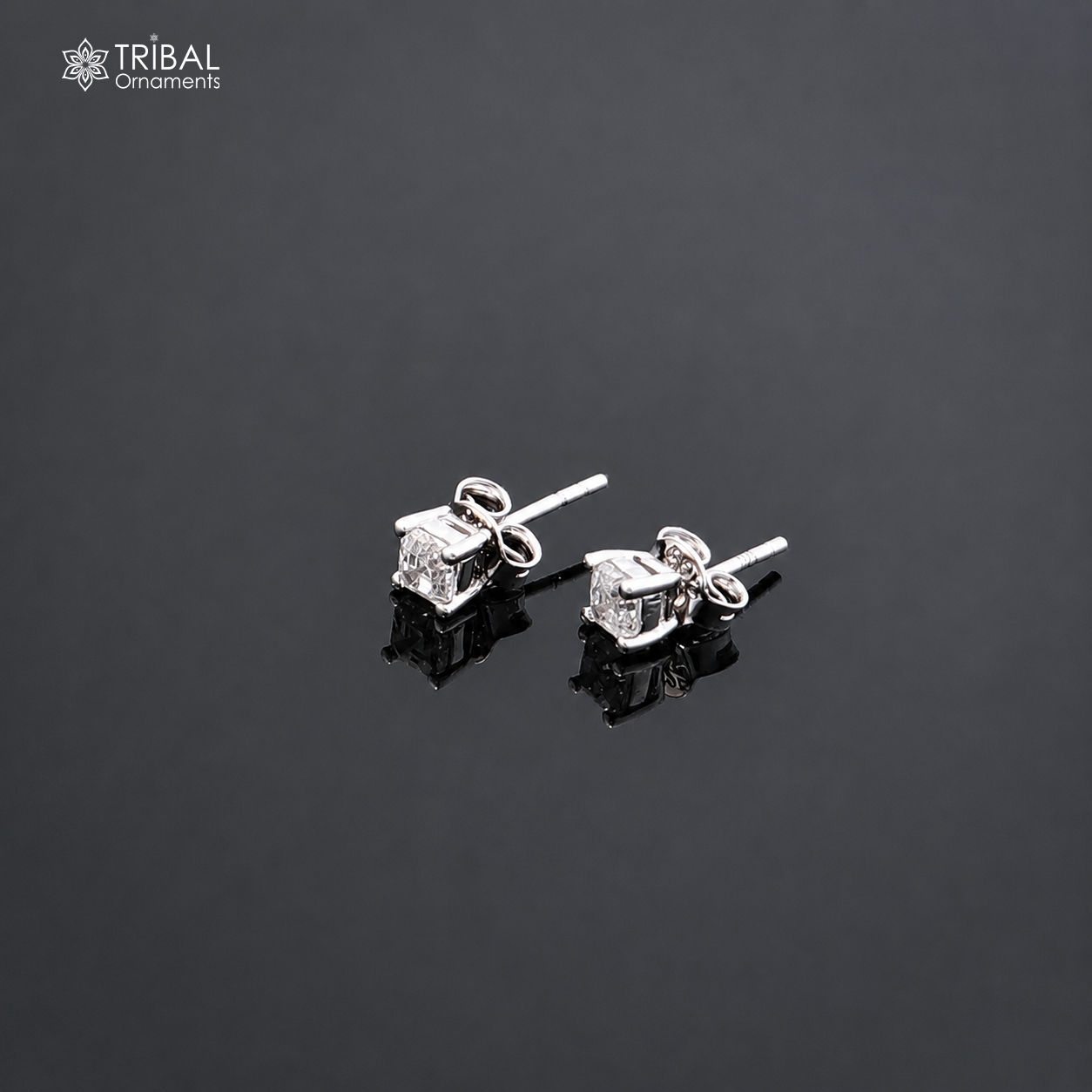 Sterling silver square-shaped white diamond stud earring by TRIBAL ORNAMENTS, unisex jewelry with a polished finish.
